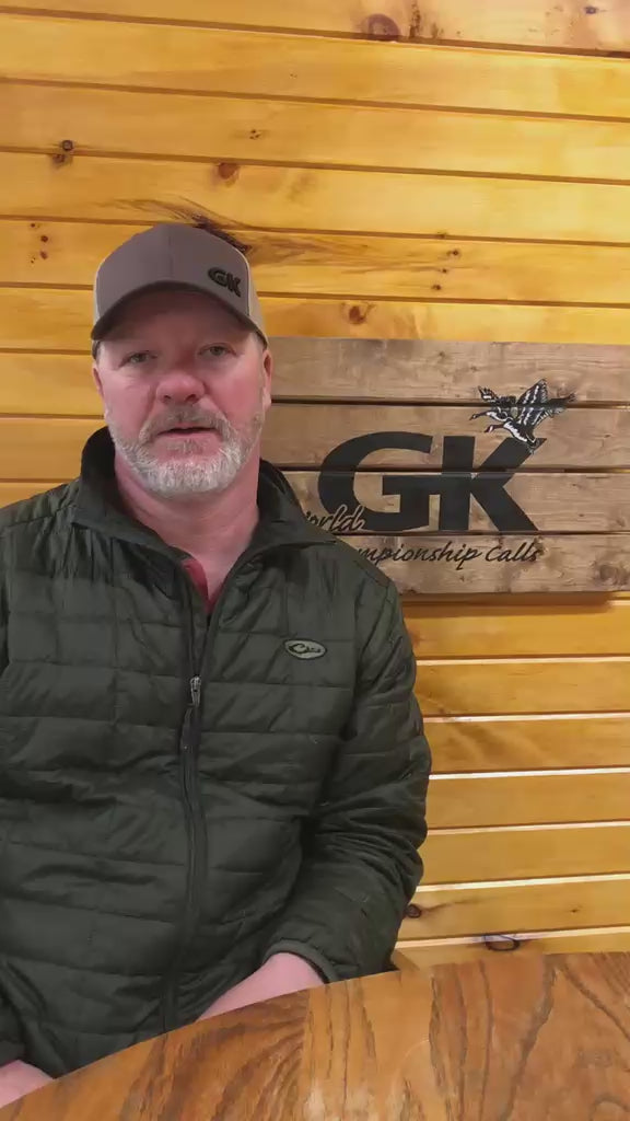 Load video: Canada goose caller demonstrating how to make a double cluck on a short-reed goose call.